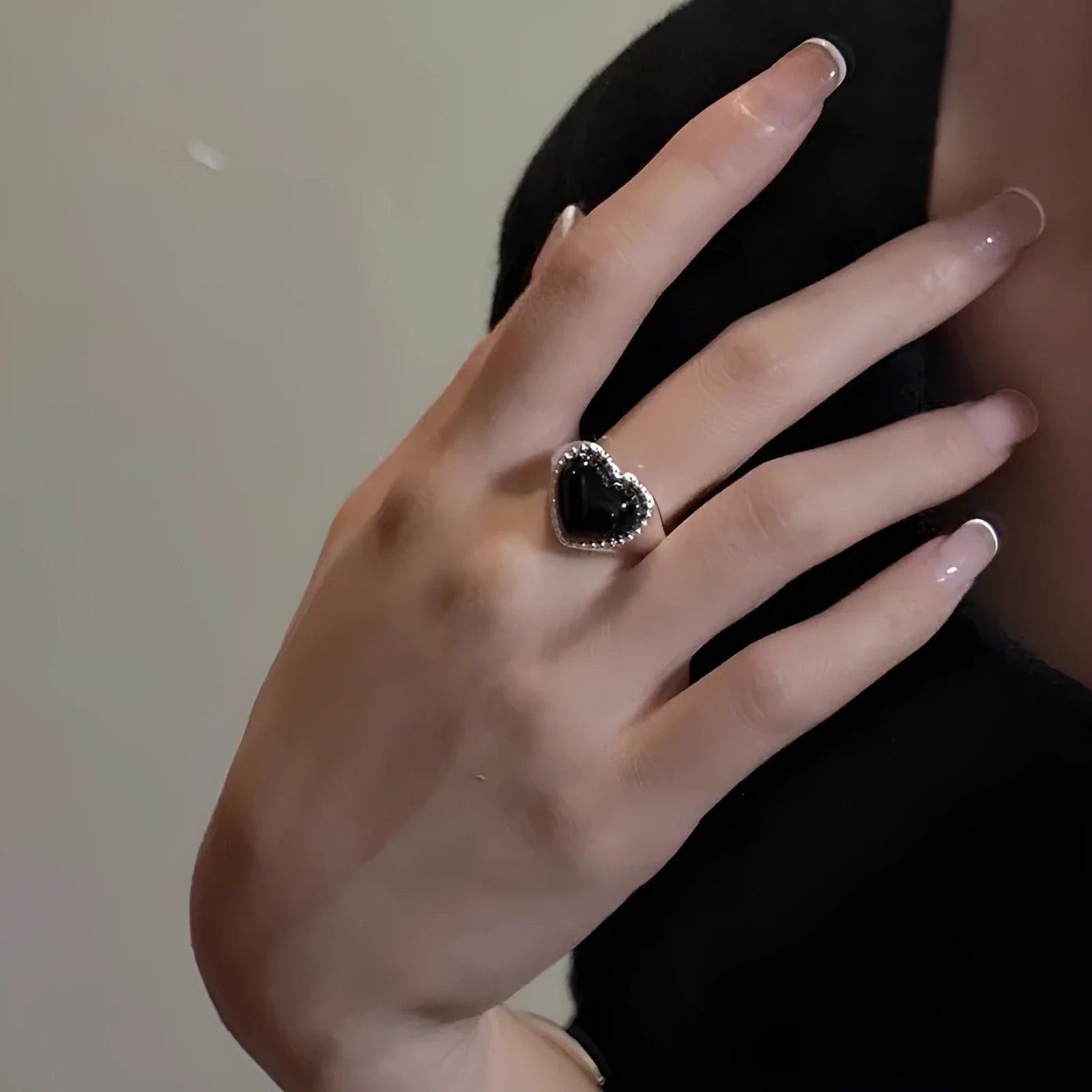 Adjustable sterling silver ring with heart-shaped black agate stone on open mouth design