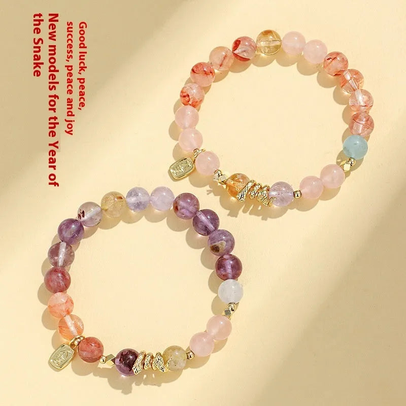 Women's lucky snake crystal bead bracelet with plastic flower decorations and beast pattern detailing