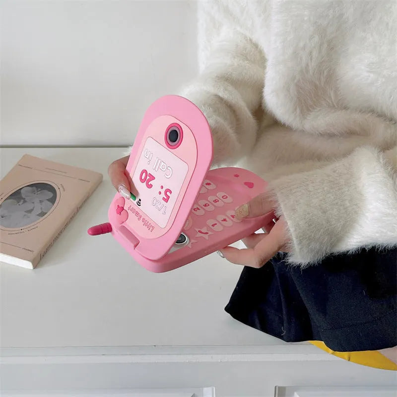 Pink silicone flip phone case with mirror for iPhone models.