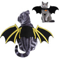Pet dog or cat wearing a cloth bat-wing print costume with bell on a plain background