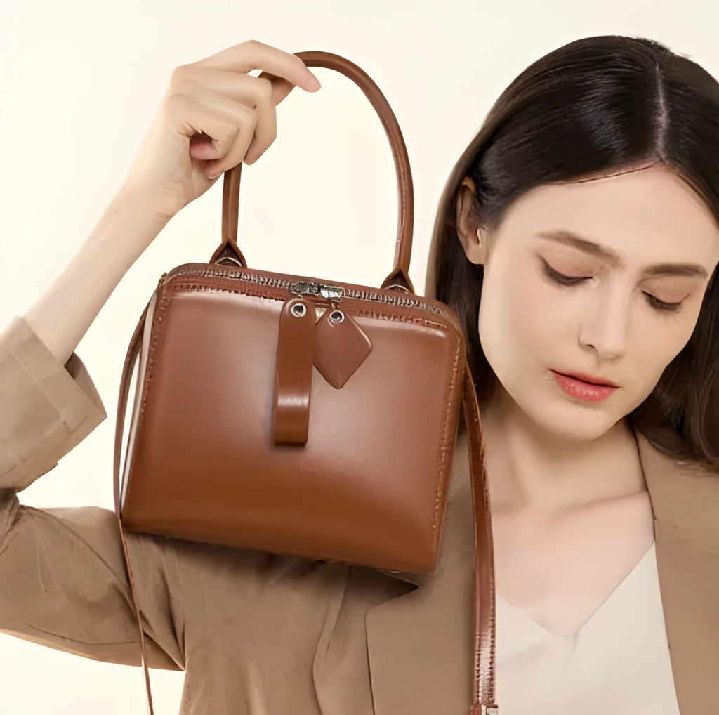 Open grain leather handbag with cowhide lining and welt pocket in black, brown or creamy white