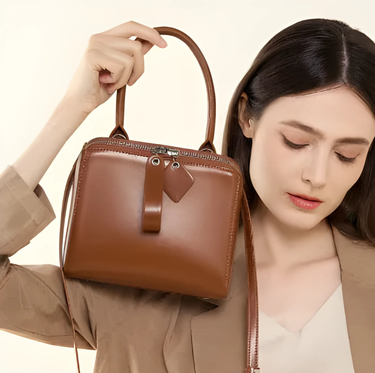 Open grain leather handbag with cowhide lining and welt pocket in black, brown or creamy white