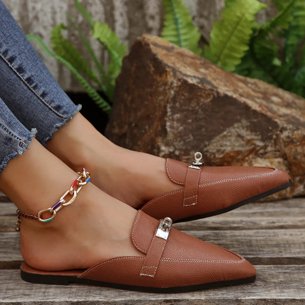 Light brown women's pointed-toe semi-slippers with a low heel and rubber sole on a white background.