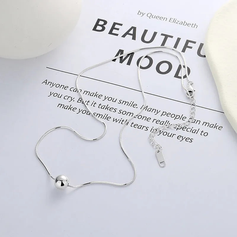 Small ball pendant on delicate 925 silver clavicle necklace with round YFL376 design