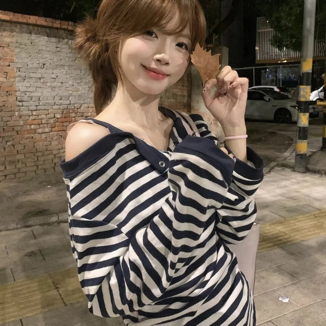 Dark blue oversized women's long-sleeved T-shirt with Korean-style embroidery and stripes.
