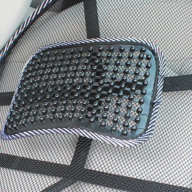 Black car lumbar support pillow with mesh cover on a car seat.