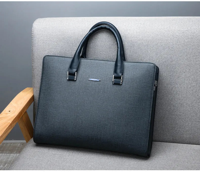 One-shoulder cross-slung male business briefcase in black PU leather horizontal square shape with stitching detail