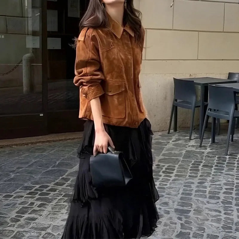 Brown suede-look polyester women's coat with regular sleeves on a hanger.