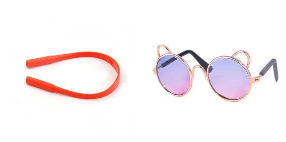 Cat wearing metal frame sunglasses in black with reflective lenses