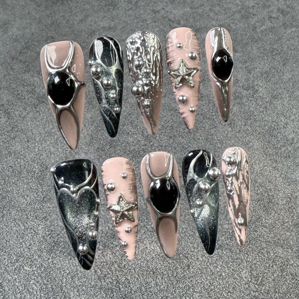Long pointed press-on false nails with embossed relief and hand-painted metal detail in XS S M L sizes