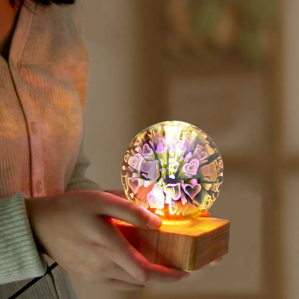 USB plug-in crystal ball night light displaying colourful firework pattern on a dark surface.