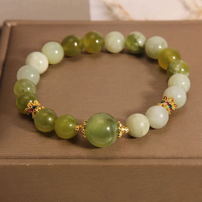 Xiuyan jade women's bracelet in jade green colour with original design.