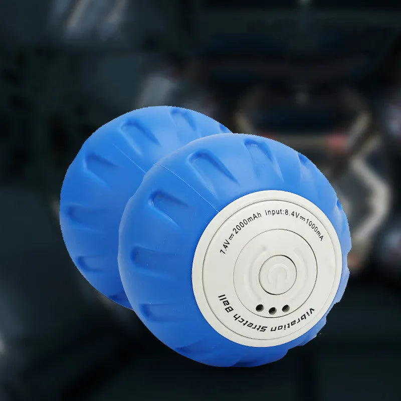 Electric vibrating peanut ball muscle relaxer in blue and black silicone with USB charger for home gym fitness massage