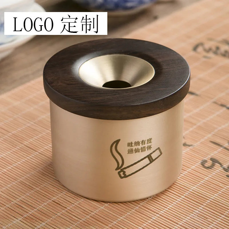 Brass ashtray with wooden lid in retro style showing middle hole design