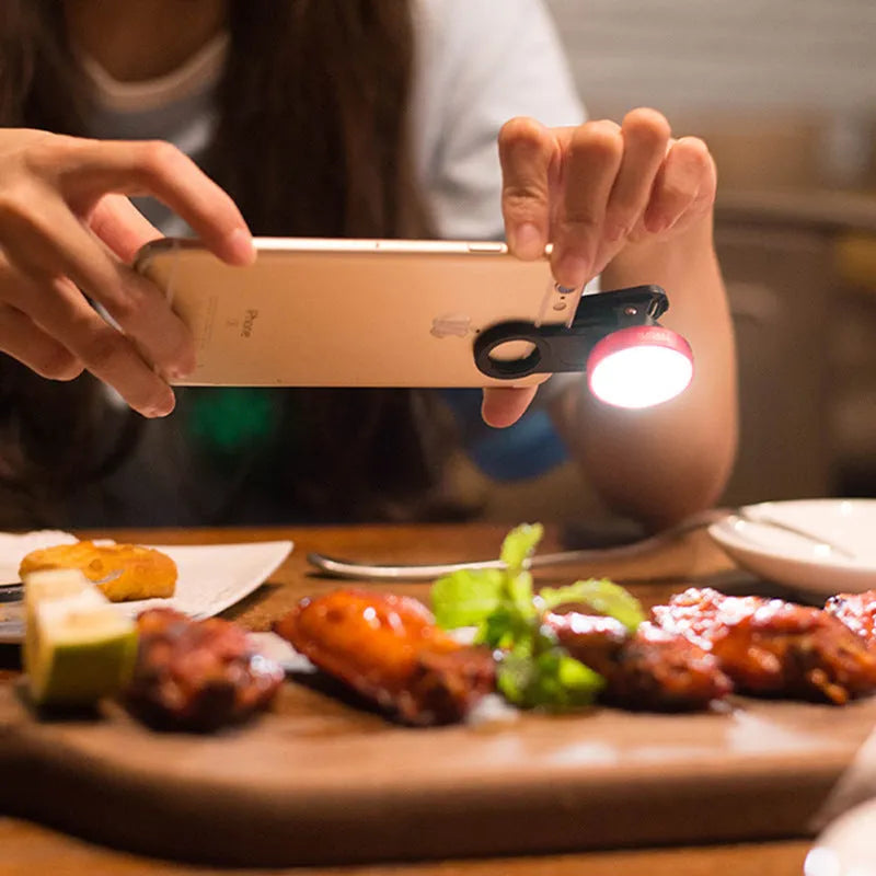 External mobile phone camera lens with wide-angle view and colourful lights, shown in black colour option