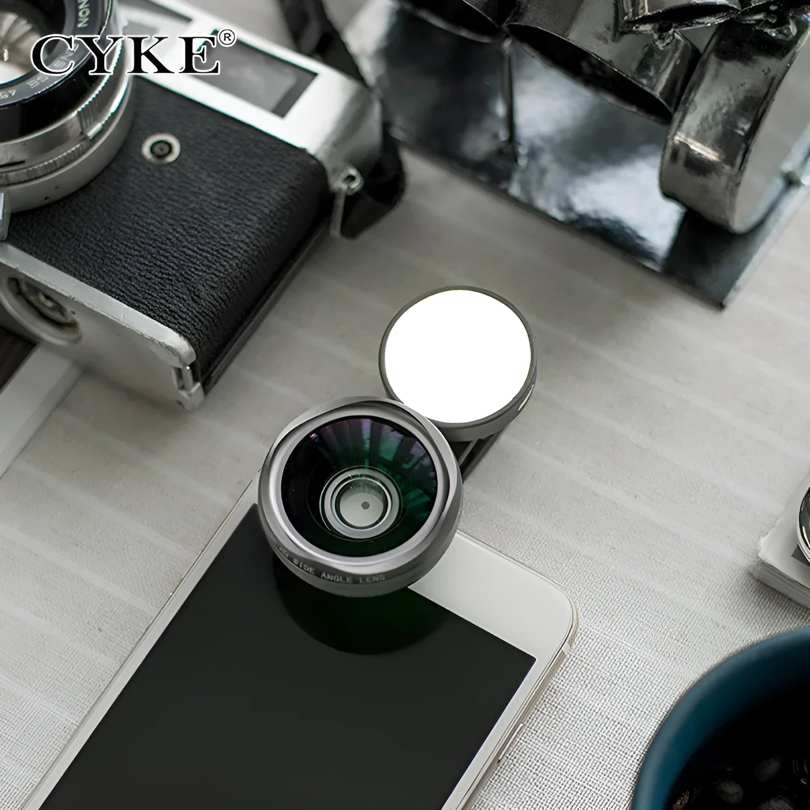 External mobile phone camera lens with wide-angle view and colourful lights, shown in black colour option