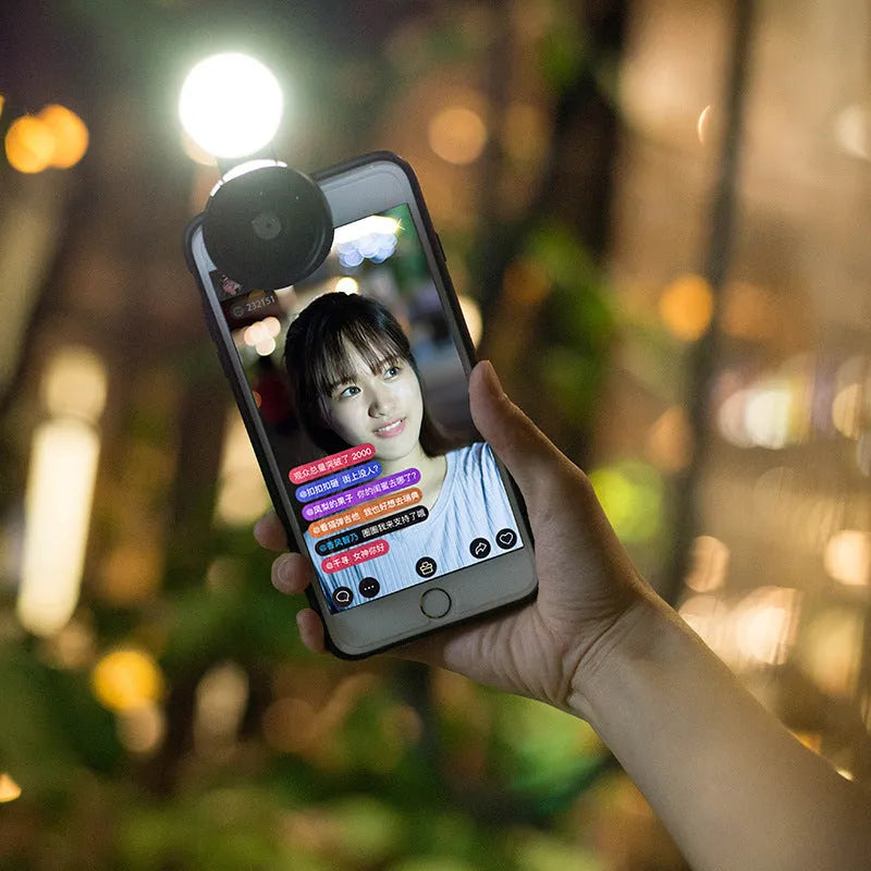 External mobile phone camera lens with wide-angle view and colourful lights, shown in black colour option
