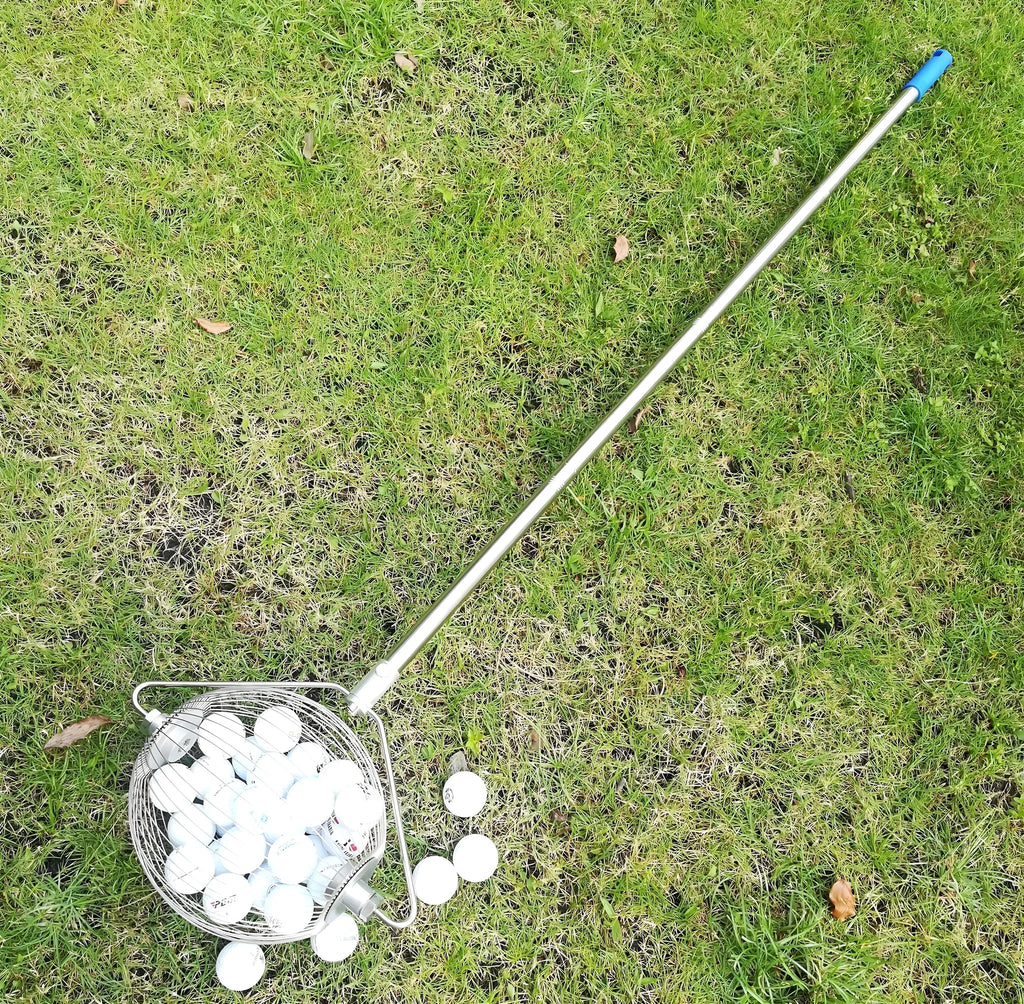 A metallic-coloured stainless steel golf ball picker or retriever tool on a green background.