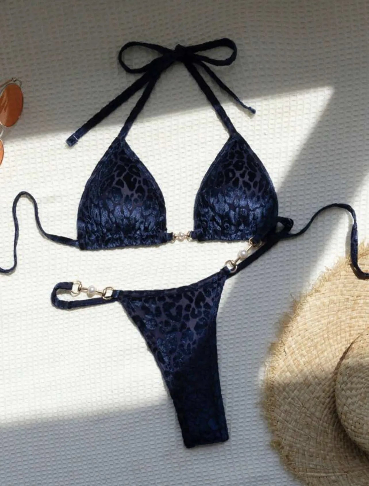 Blue leopard print women's swimsuit bikini set on a mannequin.
