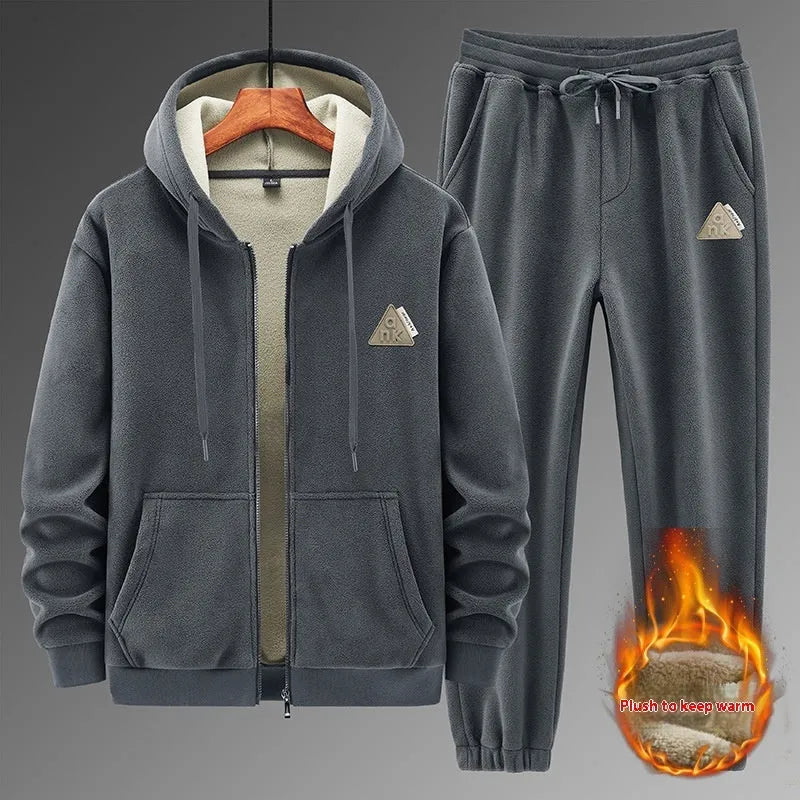 Grey men's hooded sports suit with long sleeves and full-length trousers on a neutral background.