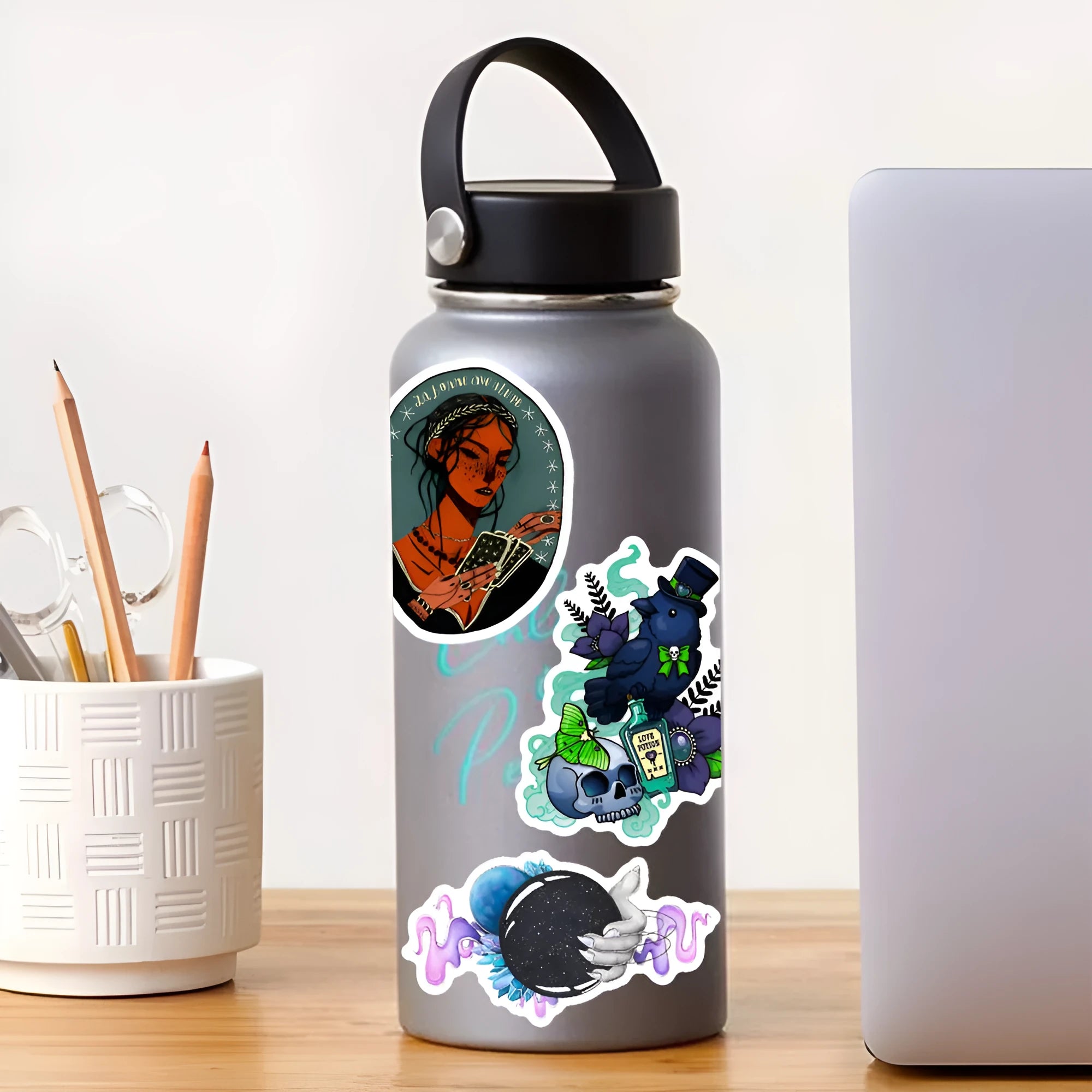 Pack of 50 glossy waterproof PVC stickers in various sizes from 3 to 8 cm for laptops and smooth surfaces.