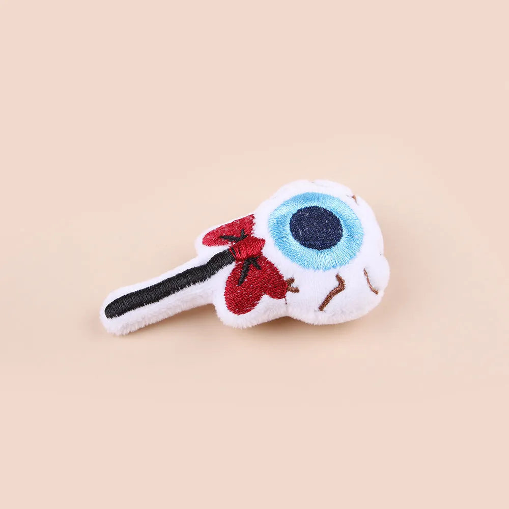Small plush cat teaser wand toy on a white background, showing eye, candy, and skull design options.
