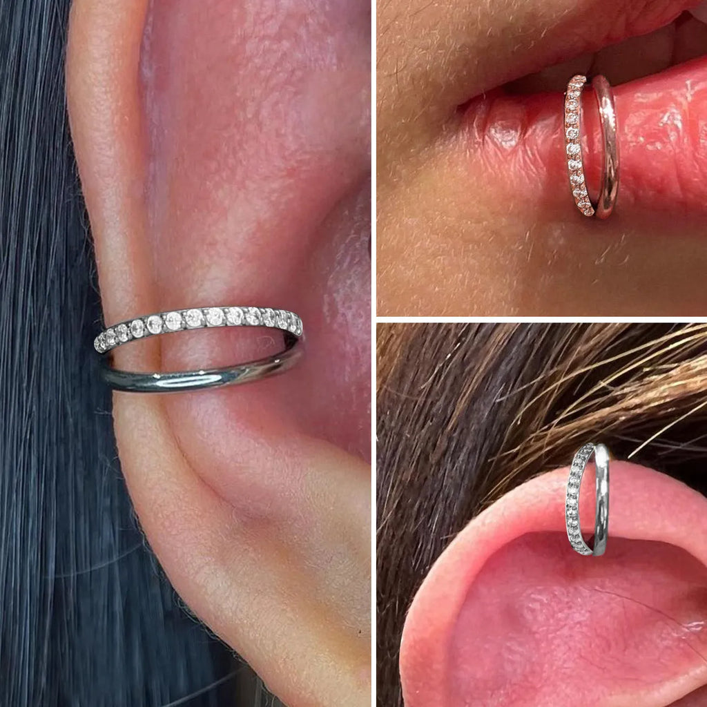 Close-up of a titanium alloy fork nose ring on a plain background, showing the straight post and bent back design.