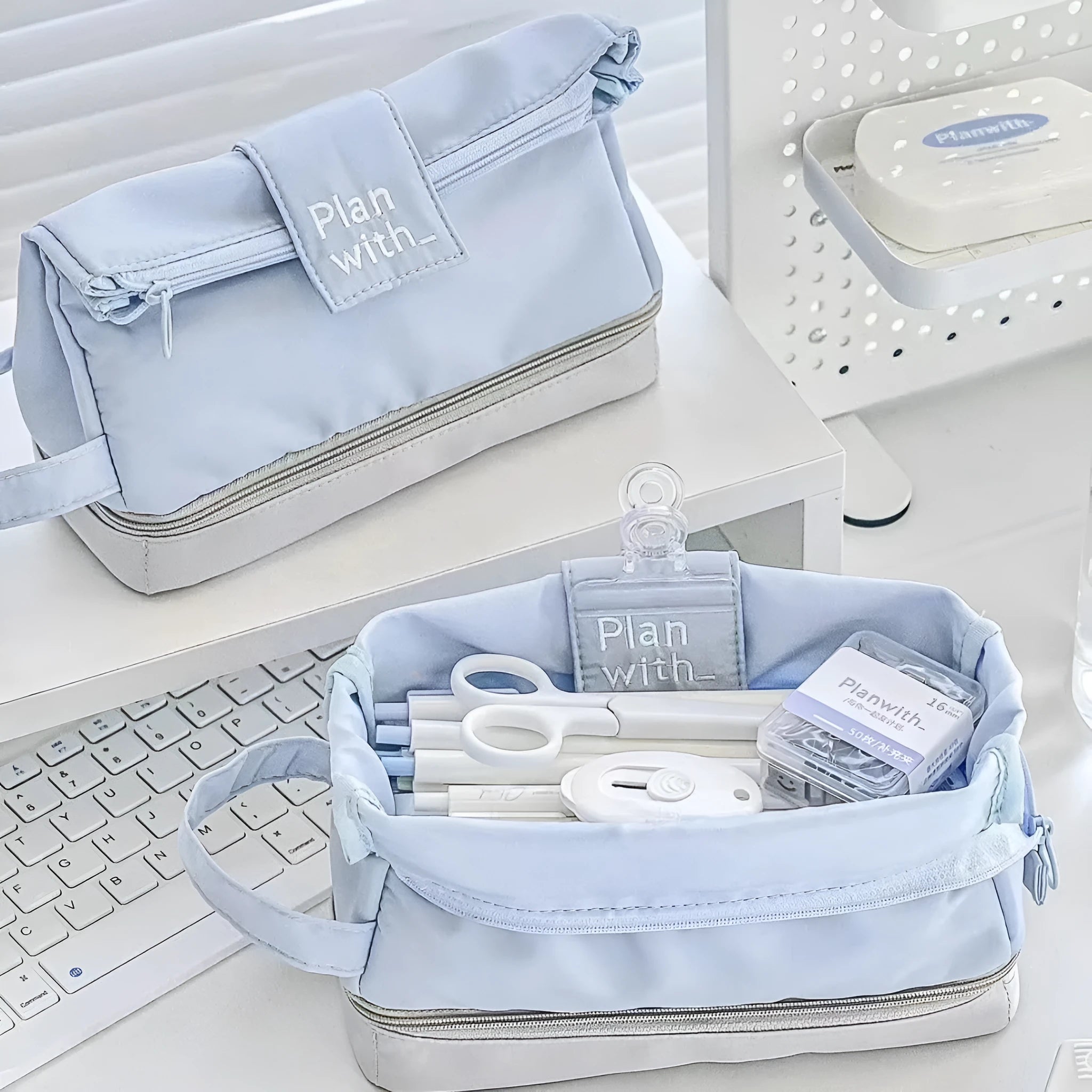 A dark blue folding double-layer pencil case for school stationery.