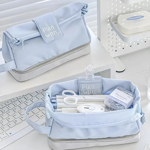 A dark blue folding double-layer pencil case for school stationery.