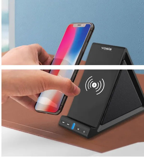 Black multifunctional Bluetooth speaker with integrated phone stand and wireless charging pad, showing size relative to a mobile phone.