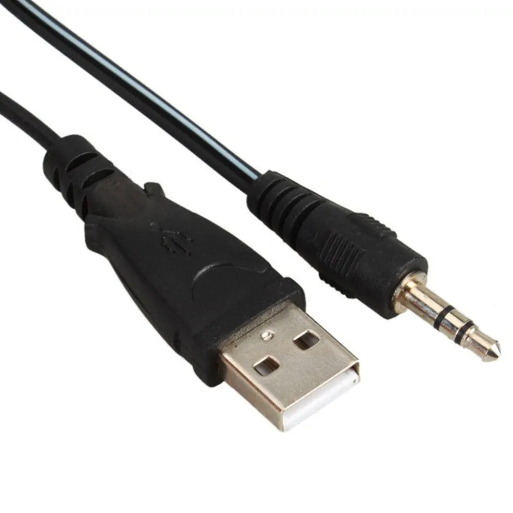 A black notebook mini speaker with a USB cable for computer audio.