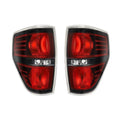 Pair of Ford F-150 taillight modification stop lamps in silver and black finish