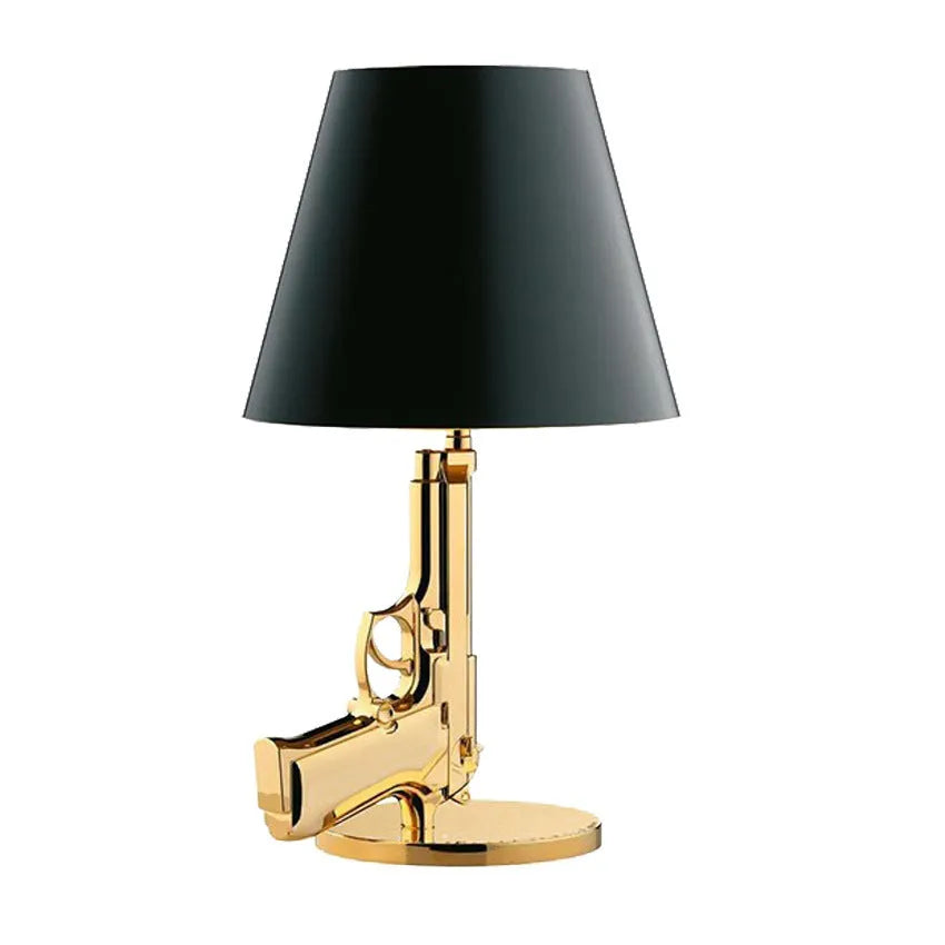 Creative resin desk lamp with plated gold pistol shape on a desk, 235x425mm, Nordic style