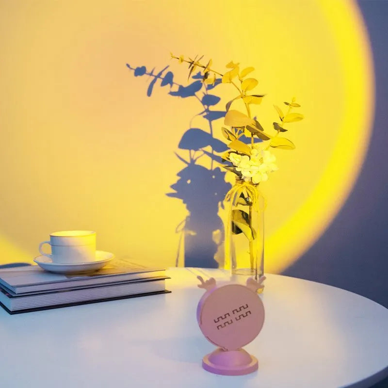Pink venison ear small night lamp on bedside table emitting warm sunset glow