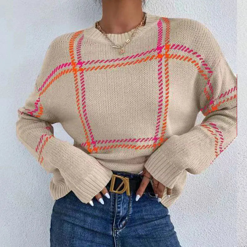Women's apricot, black, beige, red and green plaid colour-block crew neck acrylic sweater on a hanger