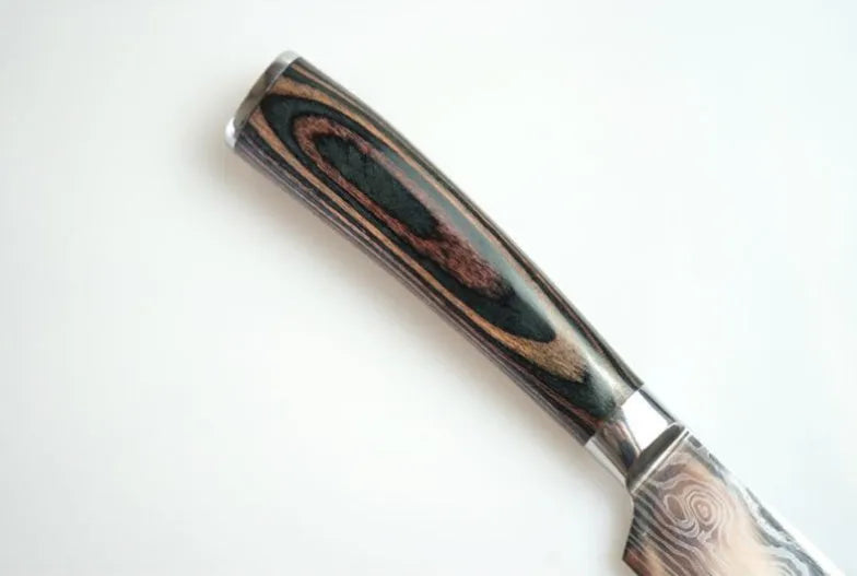 7Cr17 stainless steel kitchen knife with Damascus pattern blade and coloured wood handle on a cutting board.