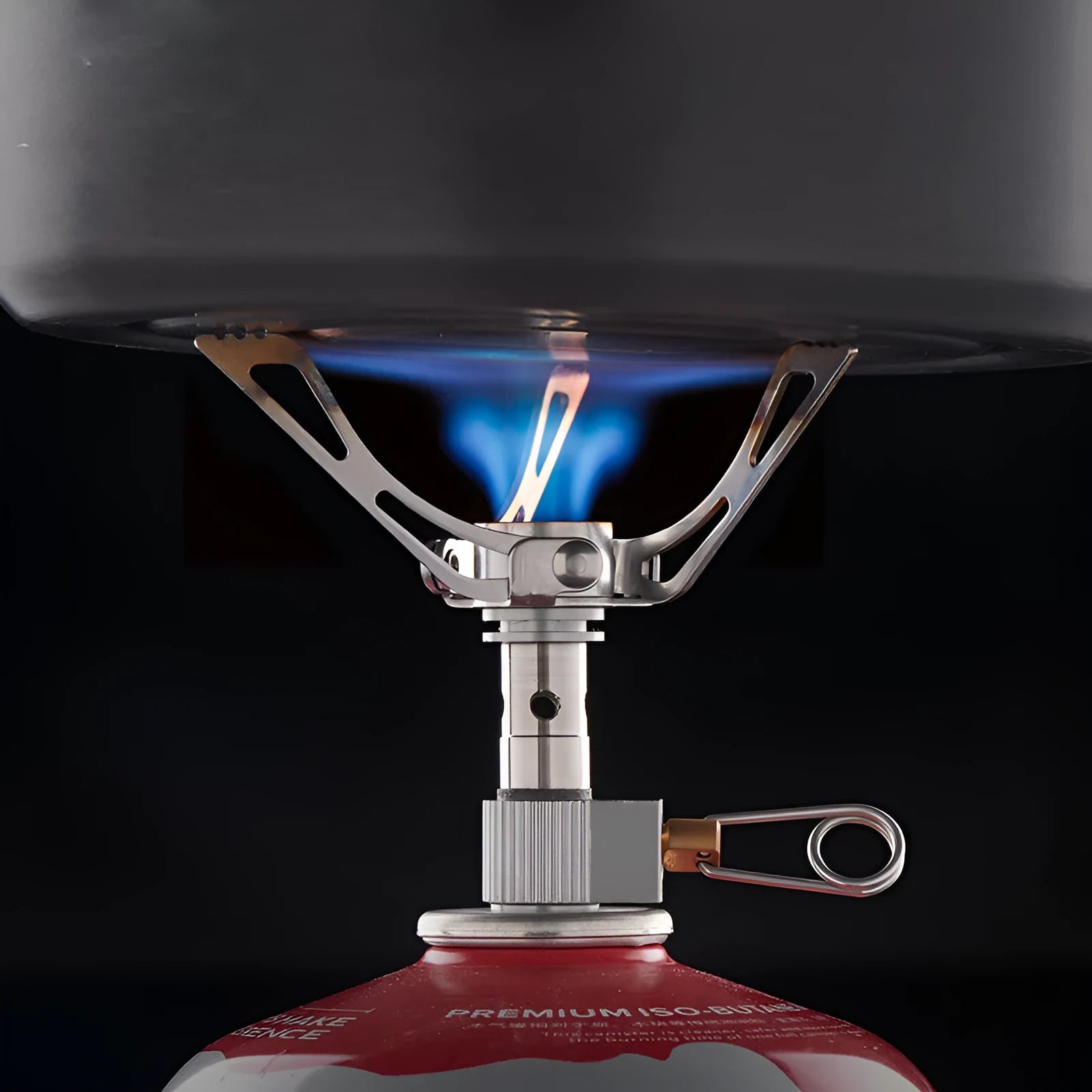 Portable folding mini camping stove in unfolded position showing 3000W burner and anti-skid bracket