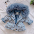 Blue denim coat for a young girl with a fleece lining and a non-removable hood.