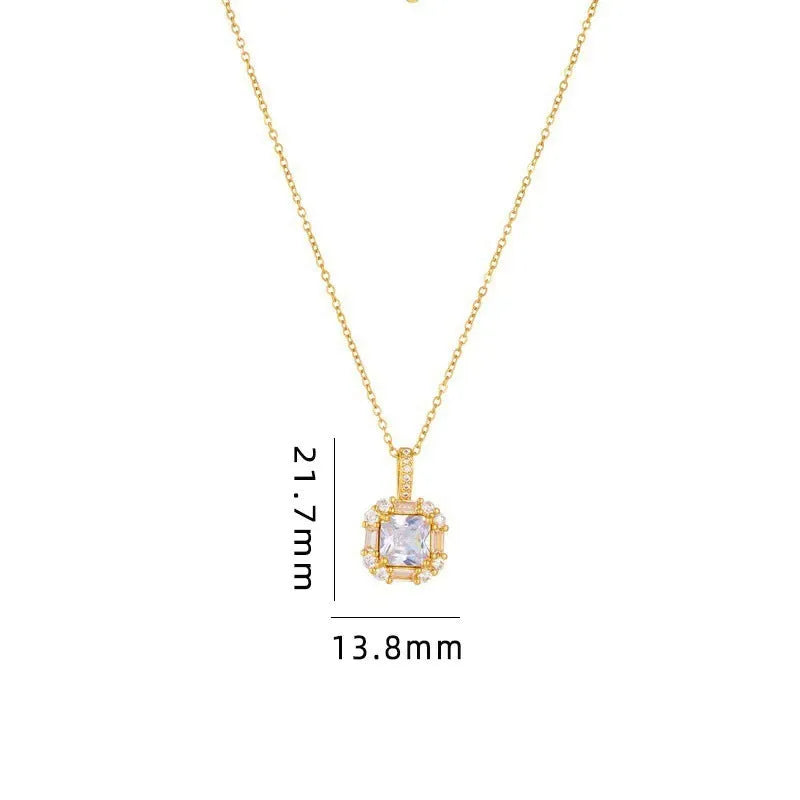 Gold geometric quadrilateral pendant necklace with gem inlay on a water wave chain.