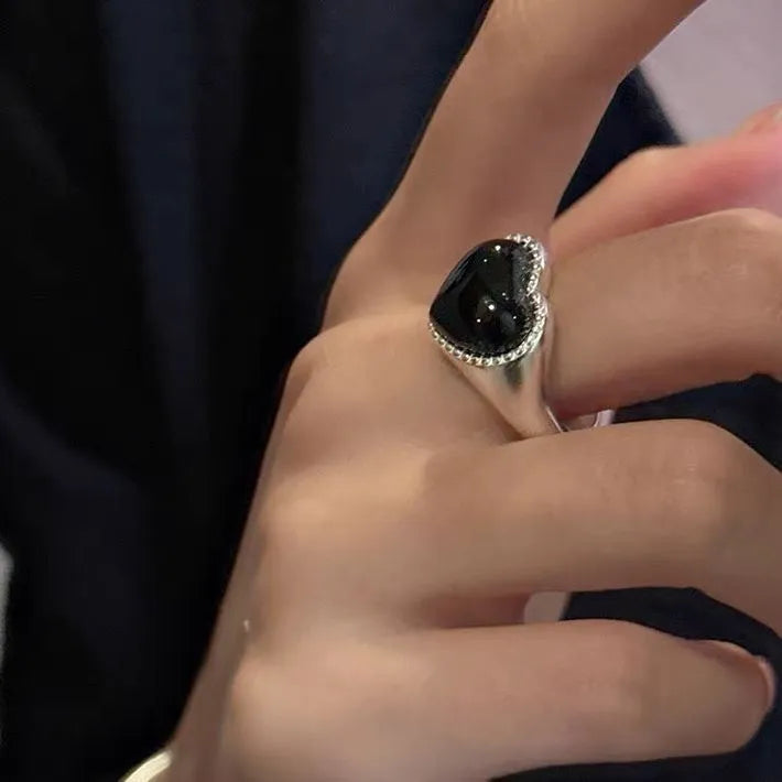 Adjustable sterling silver ring with heart-shaped black agate stone on open mouth design