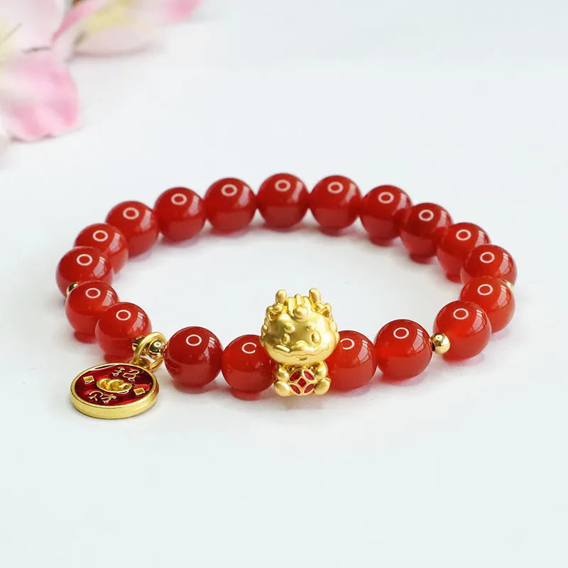 Close-up of a red agate bead dragon zodiac bracelet on a wrist, showing 8mm beads.