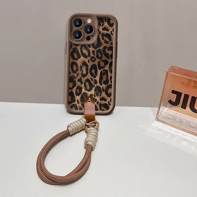 Brown leopard print silicone phone case for iPhone with an attached white lanyard strap.