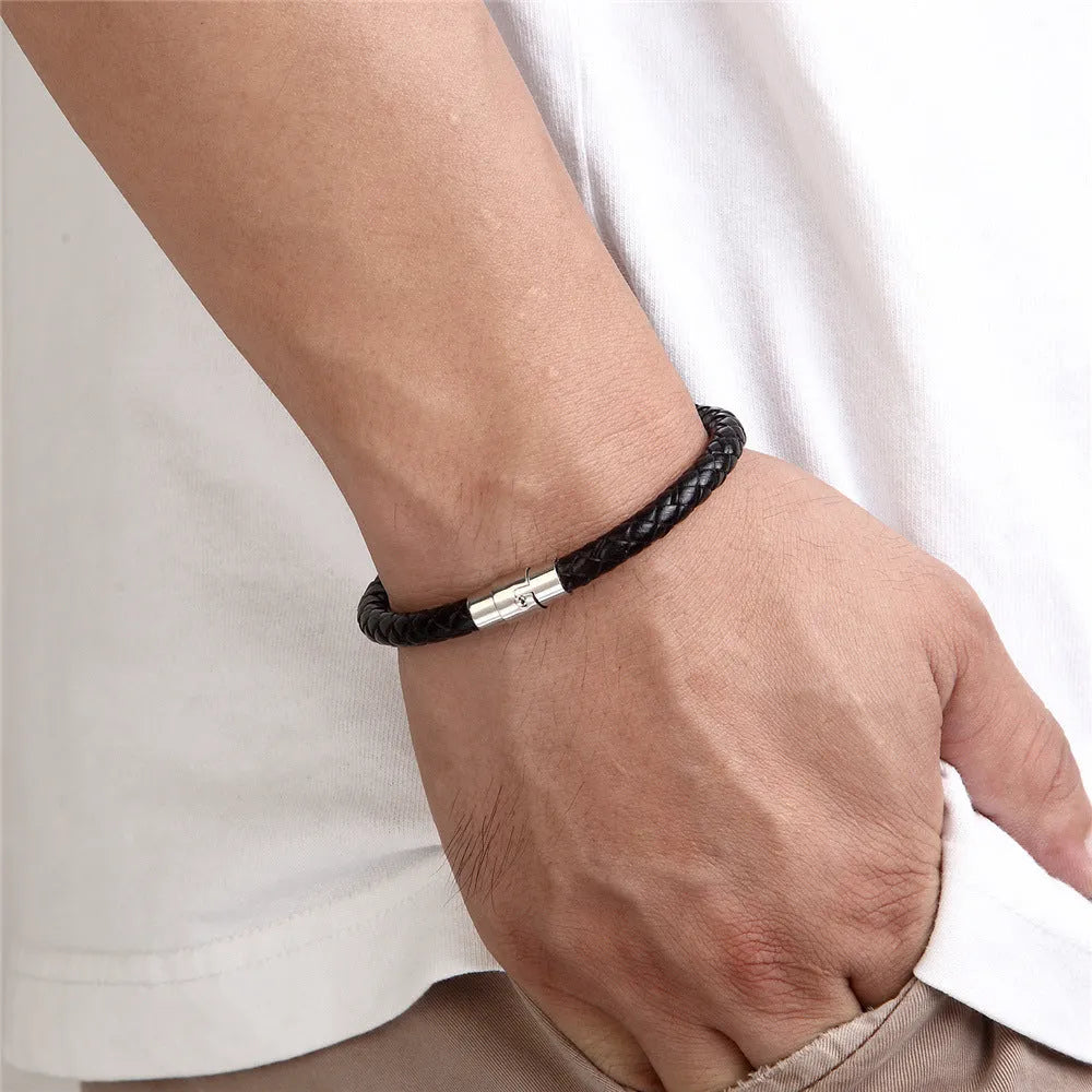 Geometric titanium steel wire bracelet with a magnetic clasp on a wrist, shown in a silver tone.