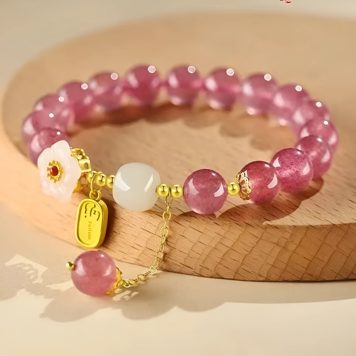 Handmade strawberry quartz crystal bracelet with Hetian jade peach blossom accents in natural style