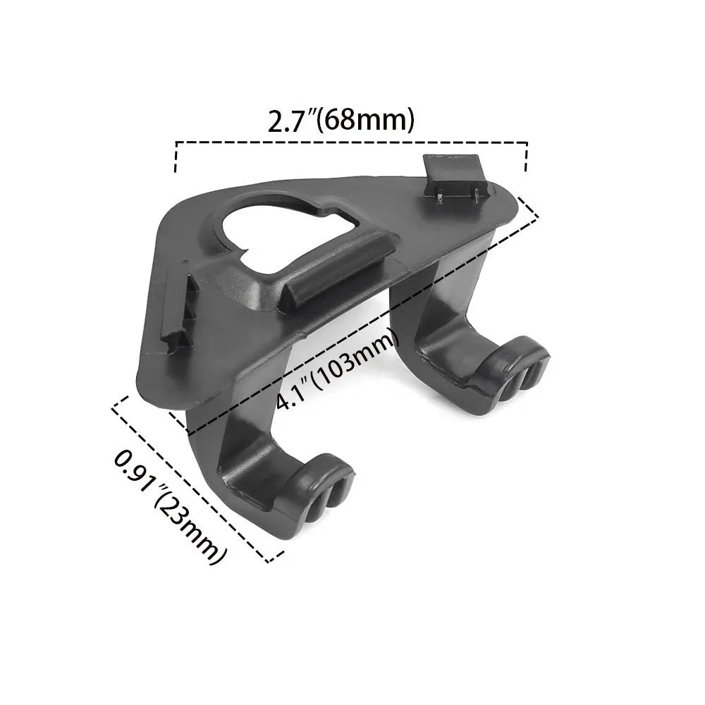 Single black ABS plastic trunk lid hook for Tesla Model Y on dark surface