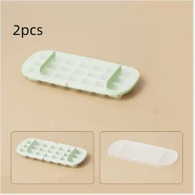 High capacity plastic ice cube tray with lever handle and integrated storage for ice shovel.