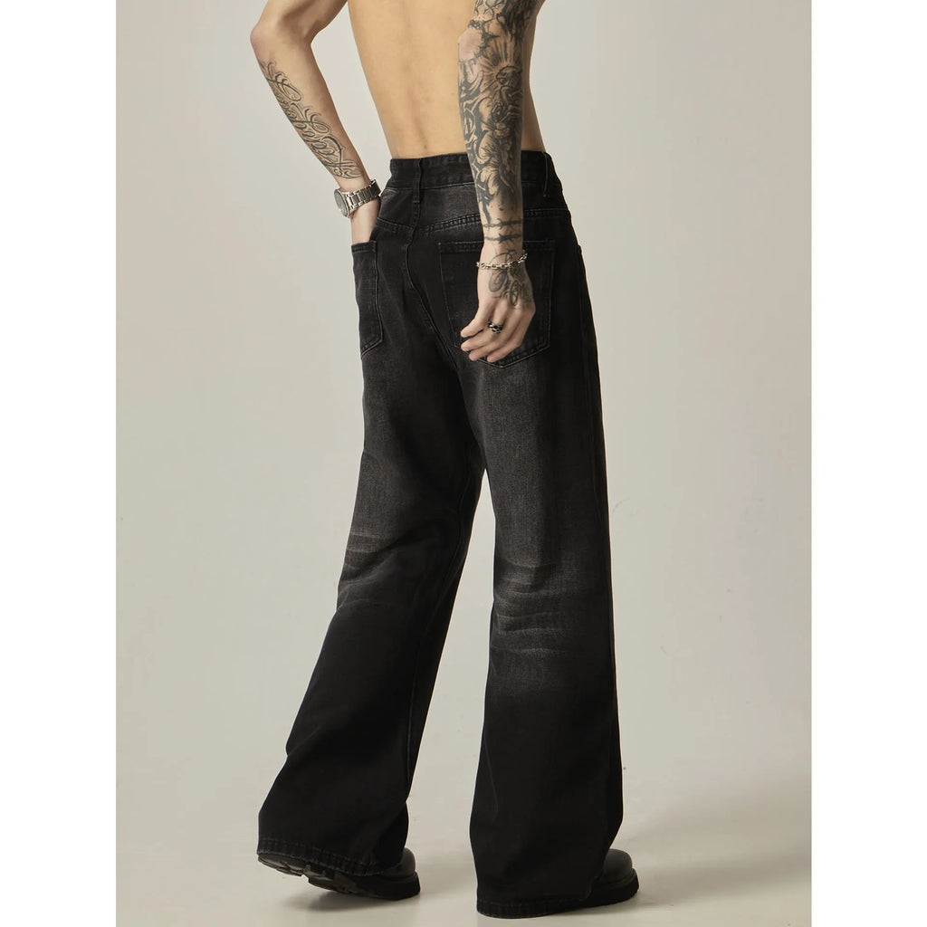 Black loose straight leg jeans with retro styling and zipper fly closure