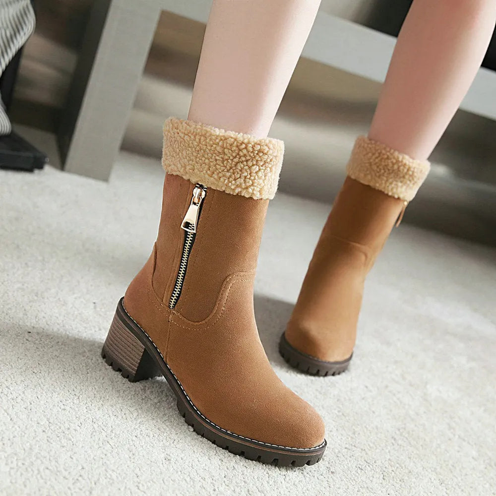 Black waterproof rubber snow boots with a thick sole and plush lining.
