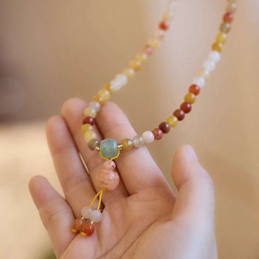 Women's Jinsi Jade bracelet with three-circle pumpkin design and tassels for 14-16cm wrists