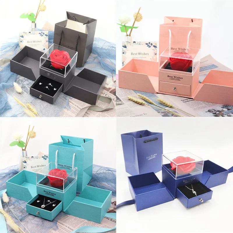 Blue cardboard jewellery gift box with removable lid for storing a plastic eternal rose and accessories.